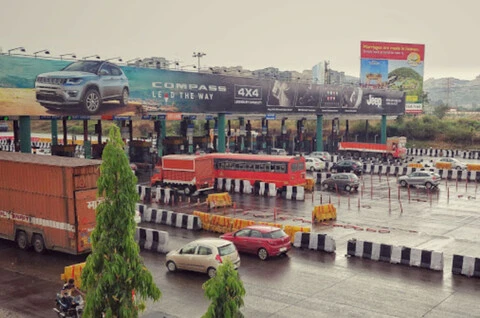 Vehicles passing through the Khalapur toll plaza using FASTag on the Mumbai Pune Expressway.